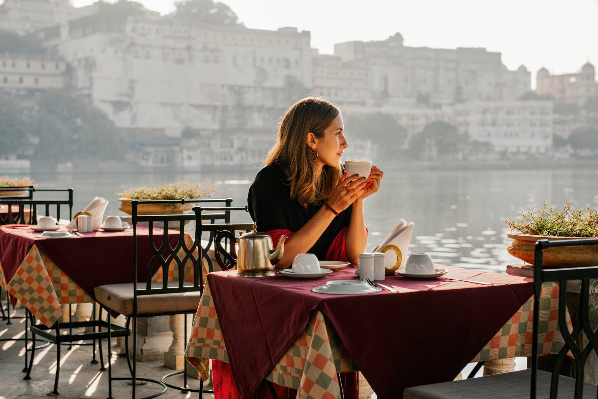 Woman drinking tea in Udaipur, India
