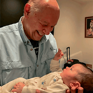 Author Don George holding his new granddaughter