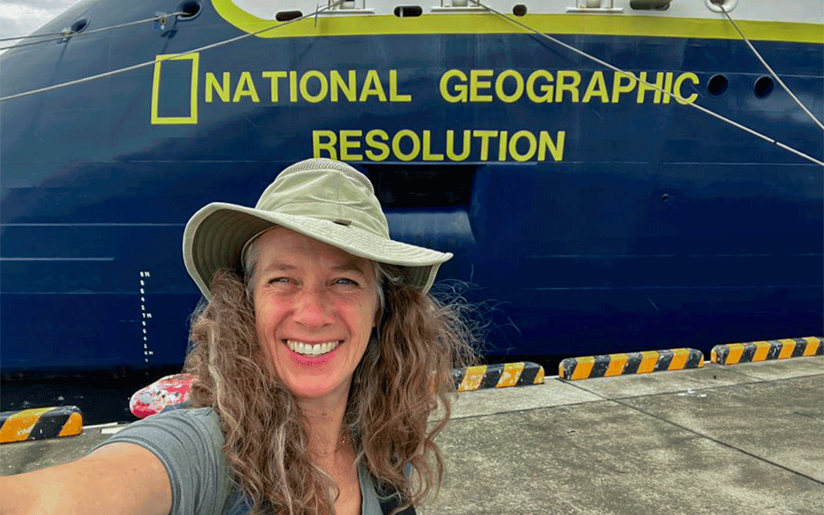 Amy Loewen in front of National Geographic Expedition ship