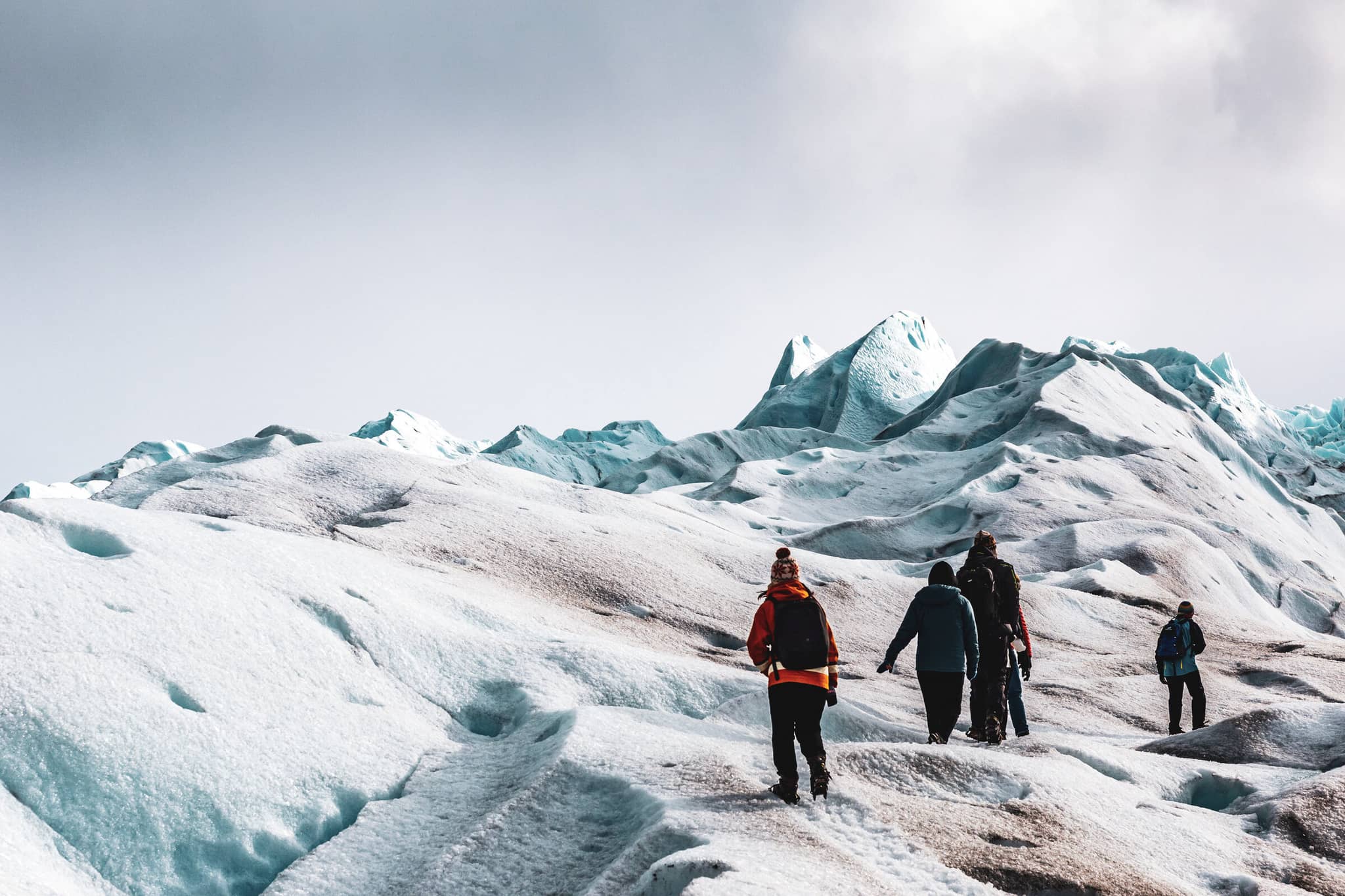 Journey through Wild Patagonia gallery 01 GalleryHero PeritoMorenoHikers Argentina DanitaDelimont RM SA01 JAN0524 SuperRes AWLImages