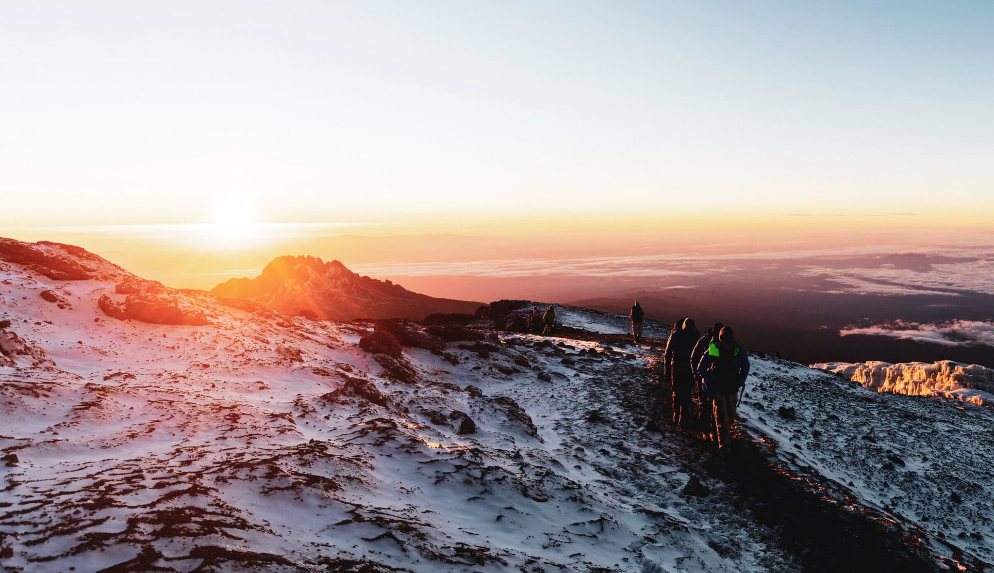 A group of hikers on a snowy peak
