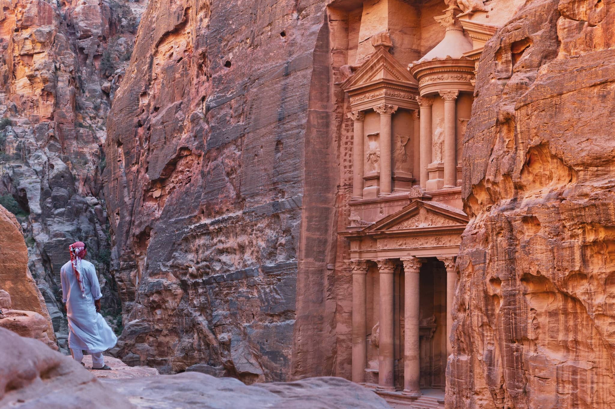 Traveler explores Petra’s ancient ruins in Jordan, a breathtaking destination perfect for under the radar travel.