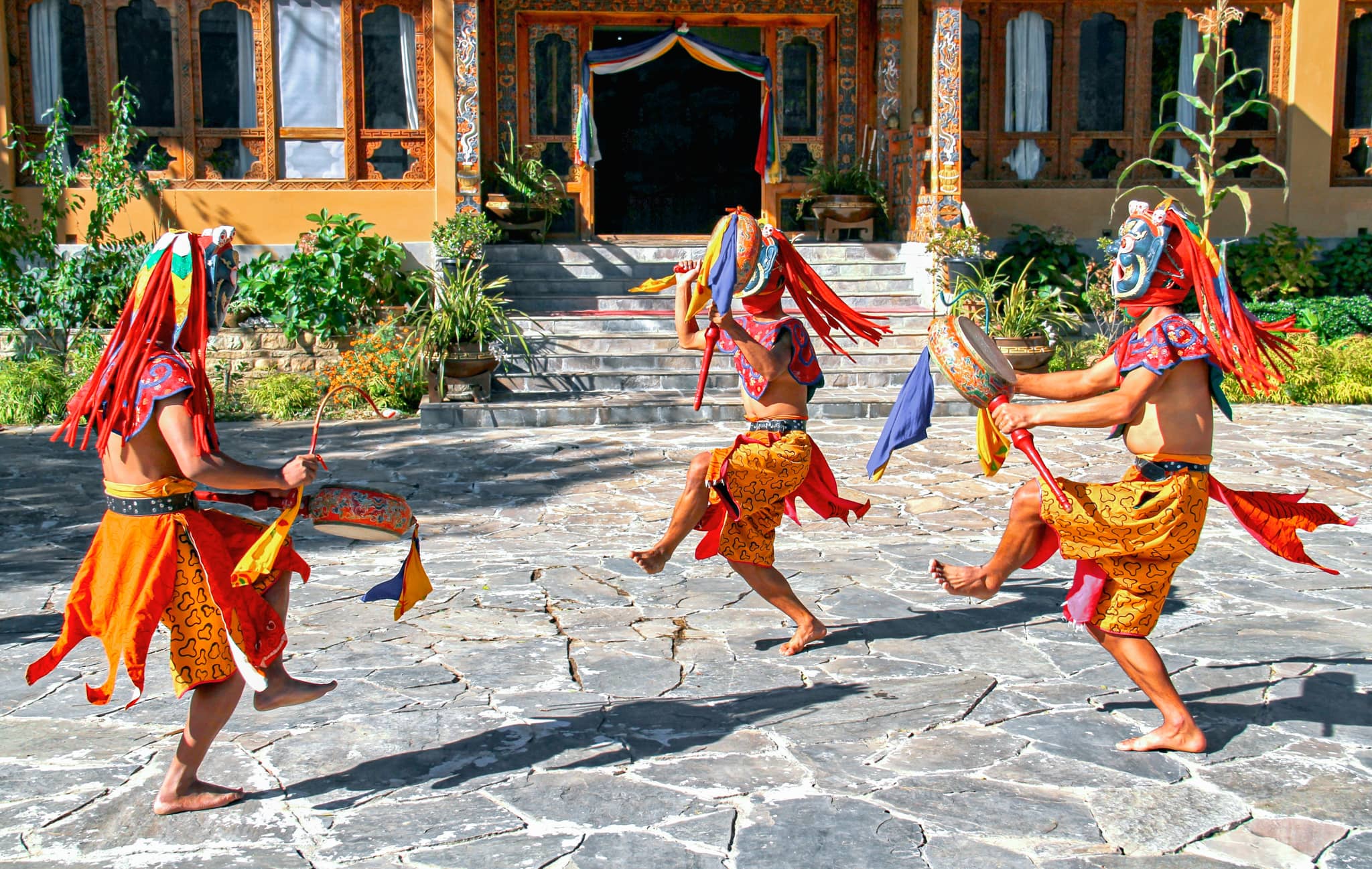 Bhutanese dancers with colorful mask performs traditional dance at hotel in Paro, Bhutan
