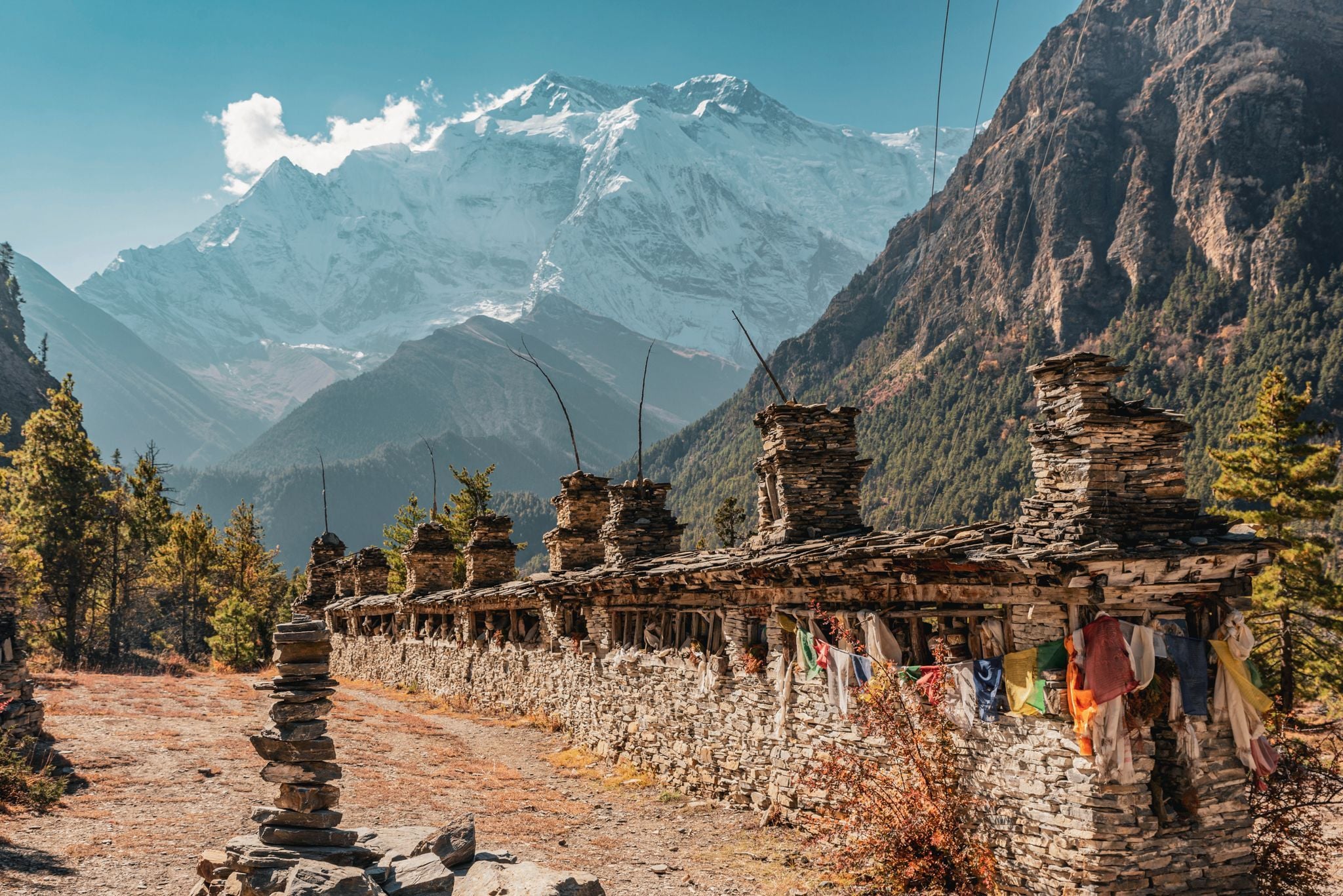 Buddhist praying wall with North Face of Everest in the background, Nepal