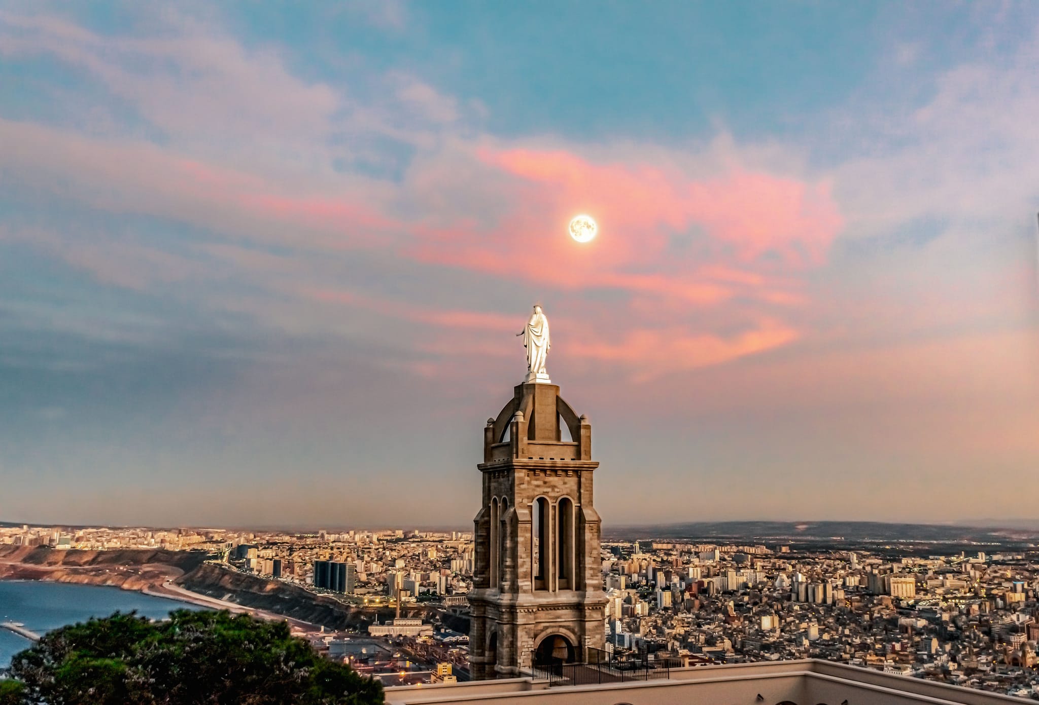 Sunset view over Oran with coastal skyline and warm golden light