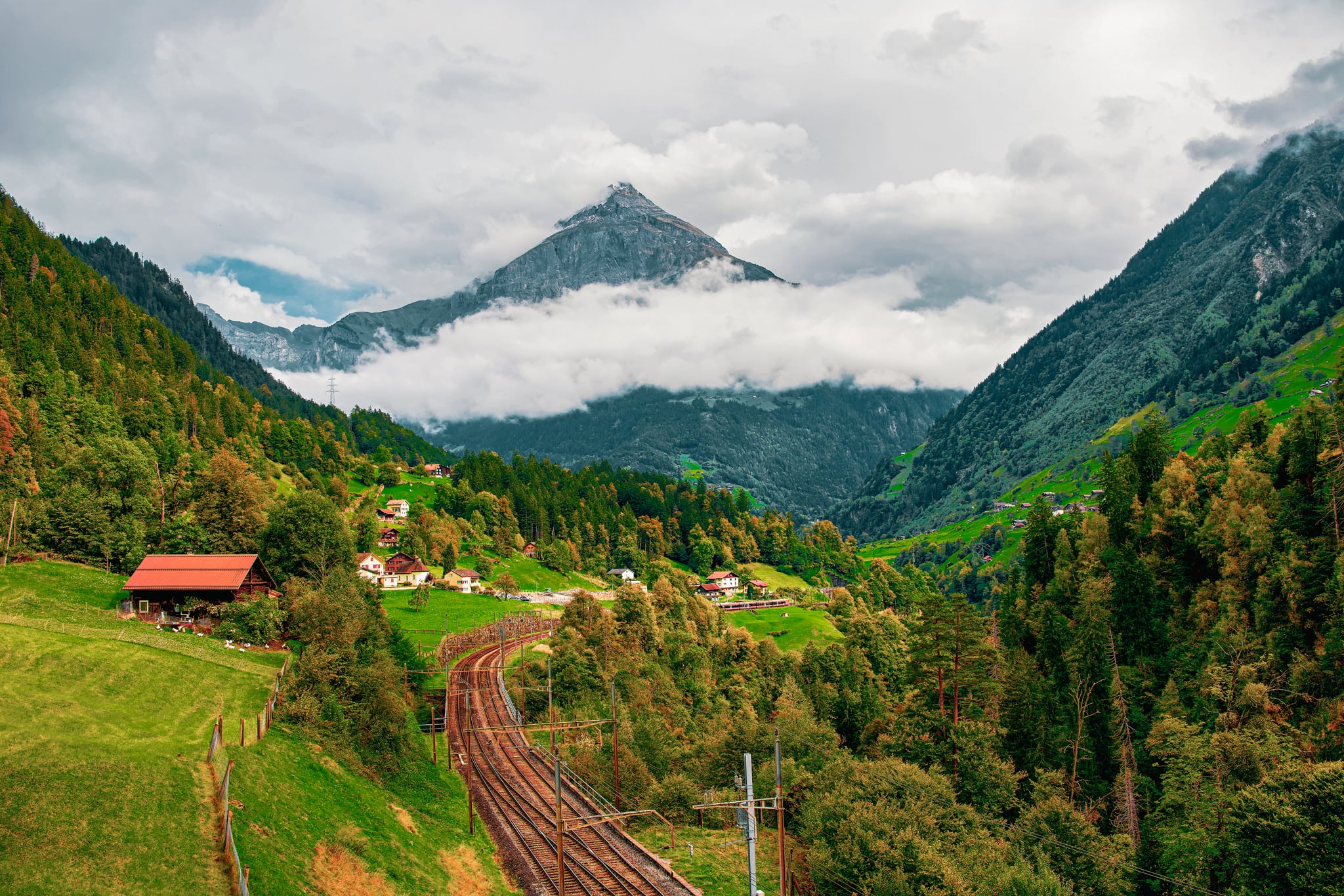 Switzerland countryside with train tracks